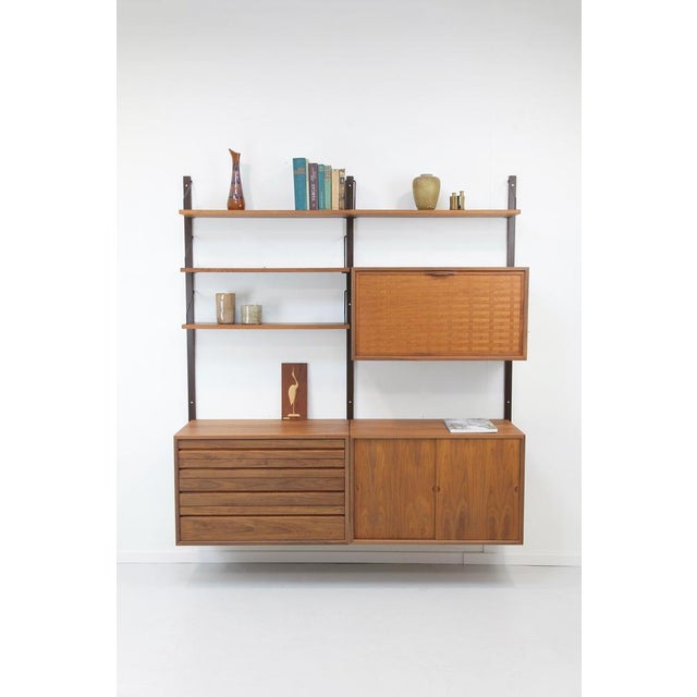 Two-strip walnut "Royal System" by Poul Cadovius for sale! Beautiful, timeless, modular wall shelving unit in exceptional...