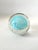 A beautiful clear glass paper weight with a Tiffany Blue Swirl of glass - the perfect size and could be a paperweight for...