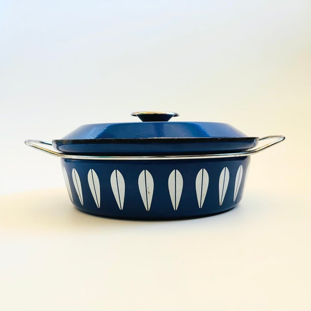 A wonderful Mid Century enamelware casserole pot made in Norway by Cathrineholm. Vibrant blue and white lotus pattern...