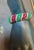Fine quality vintage 1960's bracelet set with emeralds, rubies, and round brilliant cut diamonds mounted in 18K yellow...