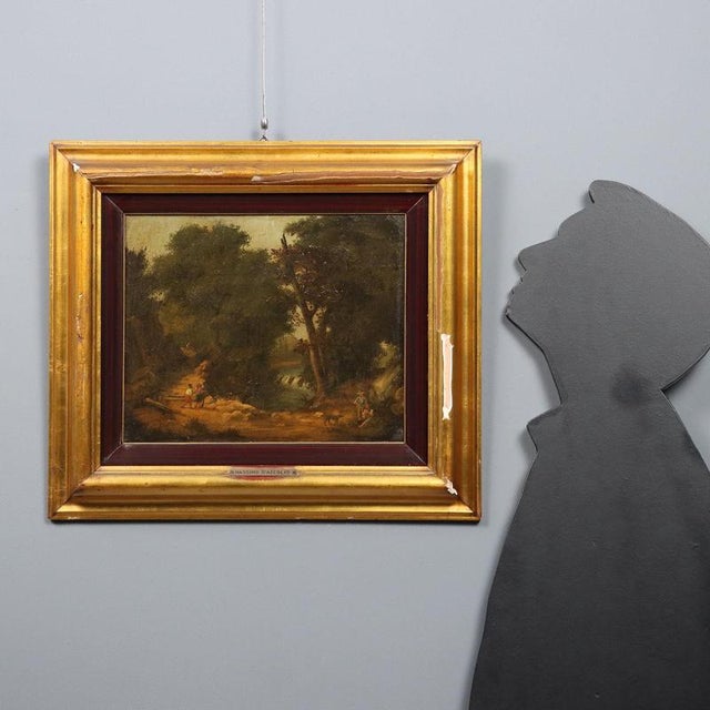 Oil on canvas. Wooded landscape with a wide path along which various popular figures pass. The frame bears the attribution...