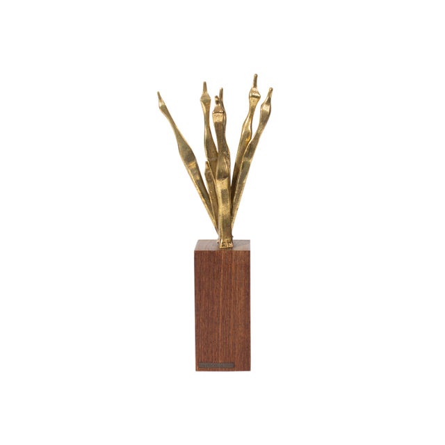A cast brass figurative sculpture by Israeli artist Aharon Bezalel (1926-2012). This abstract work depicts a row of...