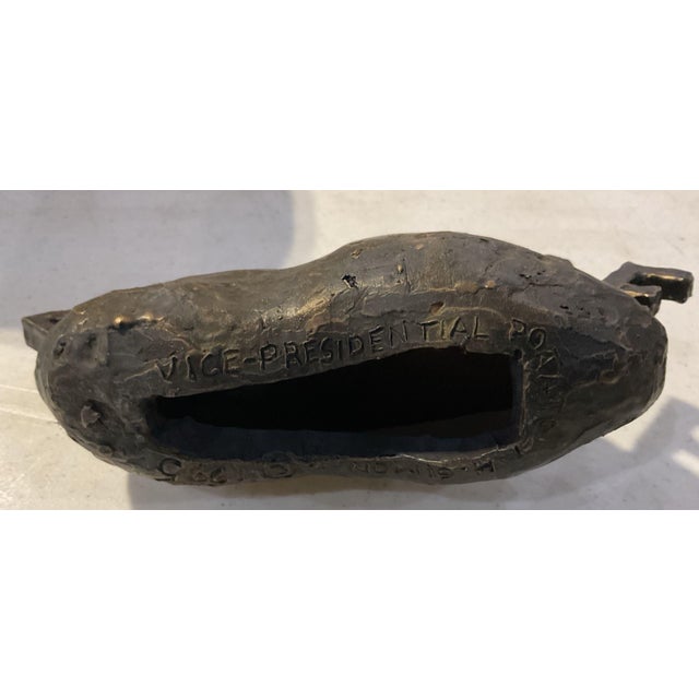 A satirical bronze sculpture titled "Vice-Presidential Potato," by Pennsylvania sculptor Herbert Simon, dated 1995. The...