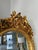 This stunning French-style full-length mirror features intricate gold leaf detailing and exceptional craftsmanship. Two...