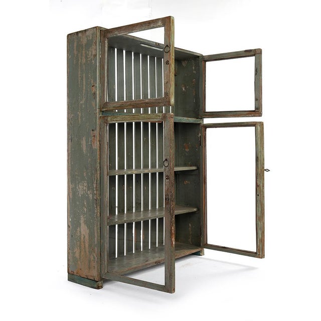 Patinated Wood Showcase, in Very Good conditions. This piece is designed in the style of the selected designer and/or...