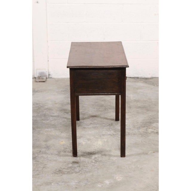 A beautifully proportioned 18th century English oak lowboy, showcasing the quiet elegance and craftsmanship of Georgian-...