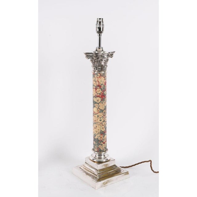 This is an impressive antique large pair of silver plated Corinthian column table lamp, circa 1920 in date. Each lamp...