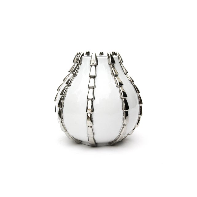 This is a large and striking Modern Art Deco vessel by Nicolas Blandin - Paris. The white glazed body is accentuated...