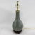 This elegant vintage table lamp features a classic bottle-shaped silhouette crafted from fine porcelain and finished in a...