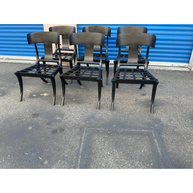 Modern patio Klismos style dining chairs. Set of 6 . The chairs are done in iron with a matte black finish. The chairs...
