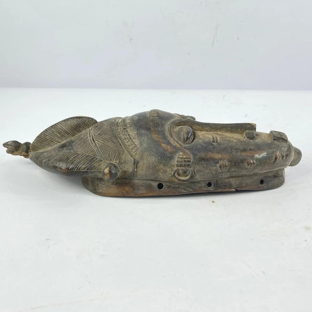 The Baule people, residing in CÃ´te d'Ivoire, West Africa, are renowned for their masterful artistry in crafting portrait...