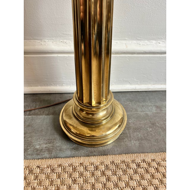 1970s Neoclassical brass table lamp by Stiffel. Substantial weight in the fluted column design. Large and striking finial...
