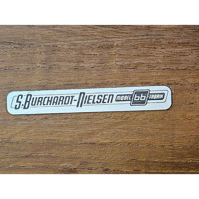 For sale is a unique, extendable dining table produced by the iconic Danish manufacture S. Burchardt-Nielsen (Møbel...
