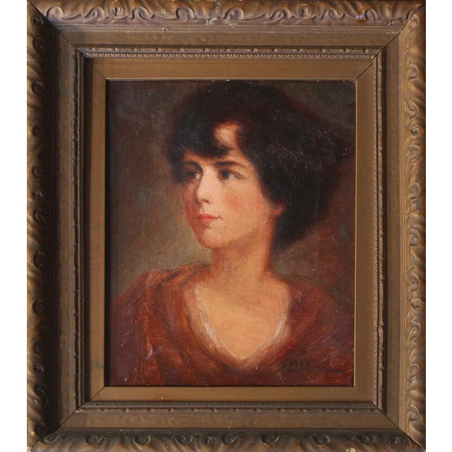 A cabinet-size oil study of a young woman wearing a maroon dress shown gazing intently to her right. Signed, lower right,...