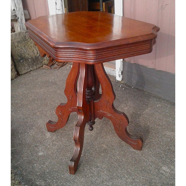 Antique Victorian or Eastlake Walnut Parlor Table 1870s An antique Victorian or Eastlake style solid walnut parlor table....
