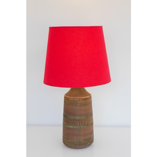 A vintage ceramic lamp, handmade by thomas anagrius for kvidinge keramik, sweden. This lamp is simple in the design, with...