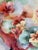 An elegant antique Bavarian porcelain cake plate featuring hand-painted floral decoration, integrated handles, and gilt...