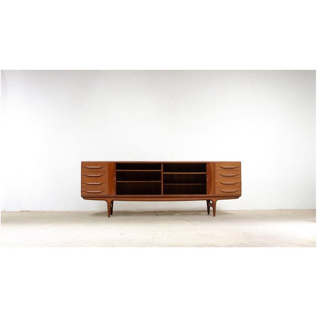 Large U-15 sideboard designed by Johannes Andersen and produced by Uldum Møbelfabrik in Denmark in the 1960s. Considered...