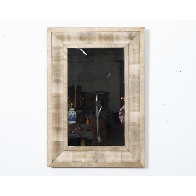 A French bleached walnut mirror from the Midcentury period with beveled frame. This exquisite French bleached walnut...