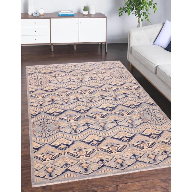 "Enhance the ambiance of your home with this magnificent Persian-influenced Turkish hand-knotted rug made by skilled...