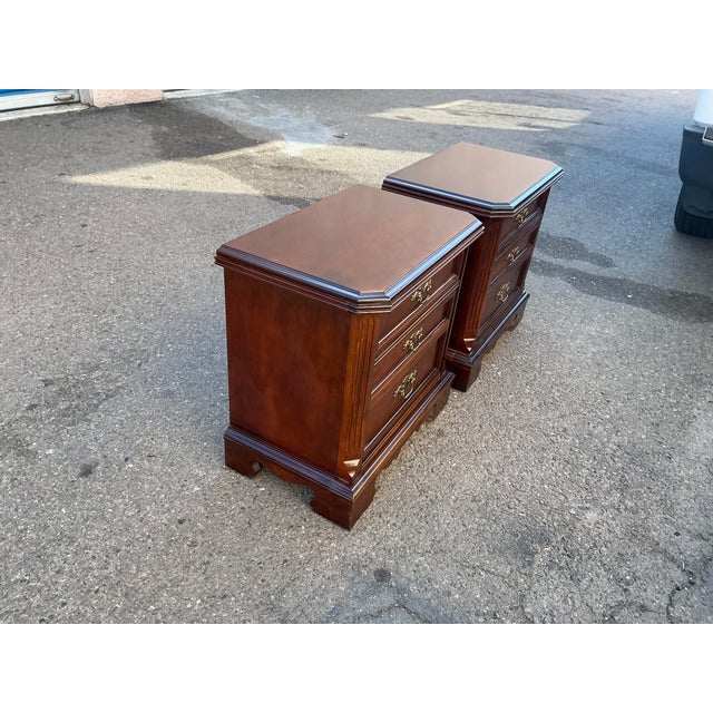 Pair of Basset mahogany stands. Good condition. Works smoothly. Some scuffs on finish. Dims 26 wide 16 deep 26 tall