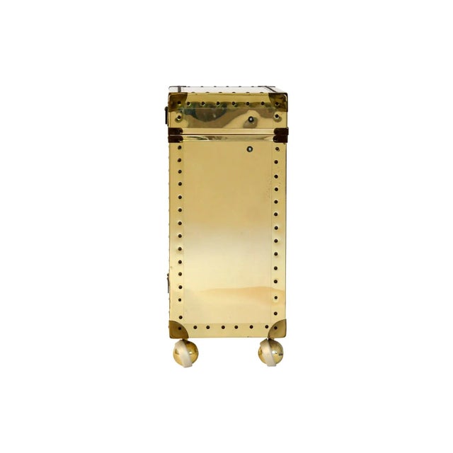 Brass clad storage chest on castors with bottom drawer for additional storage. Some minor age wear.