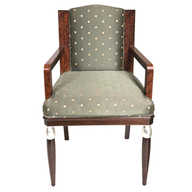 Elegant original Art Deco armchair attributed to Maurice Dufrêne, featuring a compact, architectural frame with striking...