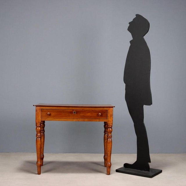 Walnut writing desk, drawer in the lower section, turned legs. Italy, 19th century. This piece is attributed to the...