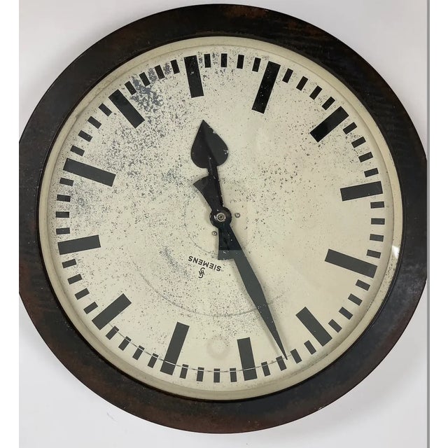 . Oversized INDUSTRIAL VINTAGE METAL CLOCK made by Siemens . Steel frame, with steel clock dial, hands, and steel back,...
