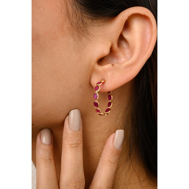 This is part of Chairish’s Fine Jewelry assortment. Elevate your style with these stunning 18K yellow gold C-hoop...