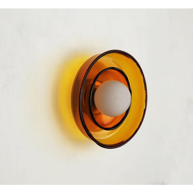 Wall light, This wall light is crafted from hand-blown glass and is offered in three variations: a large-scale glass...