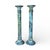 A vintage neoclassical meets brutalist style metal candleholders with a thickly patinated verdigris surface and jagged...