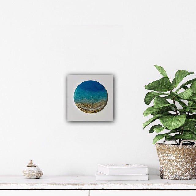 Waves of Love captures the serene beauty of ocean waves lapping against a sandy shore. The vibrant blues and textured...