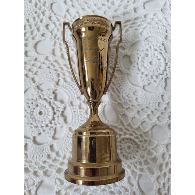 A 'Farthest Travelled Golfer' brass trophy. Measuring 6” h x 2 ½” w x 2 ¼” base and made by Dodge Inc. A wonderful gift...