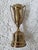 A 'Farthest Travelled Golfer' brass trophy. Measuring 6” h x 2 ½” w x 2 ¼” base and made by Dodge Inc. A wonderful gift...