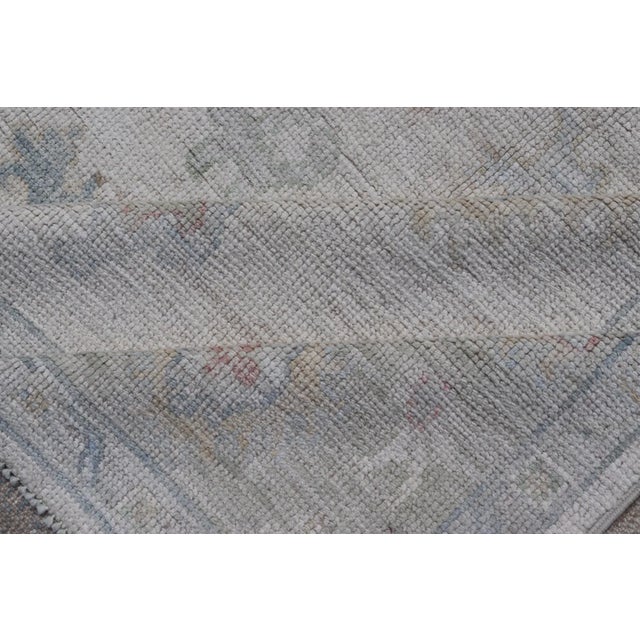 Large Oushak Rug With Floral Motifs & Muted Colorful Tones on Neutral Background For Sale - Image 11 of 12
