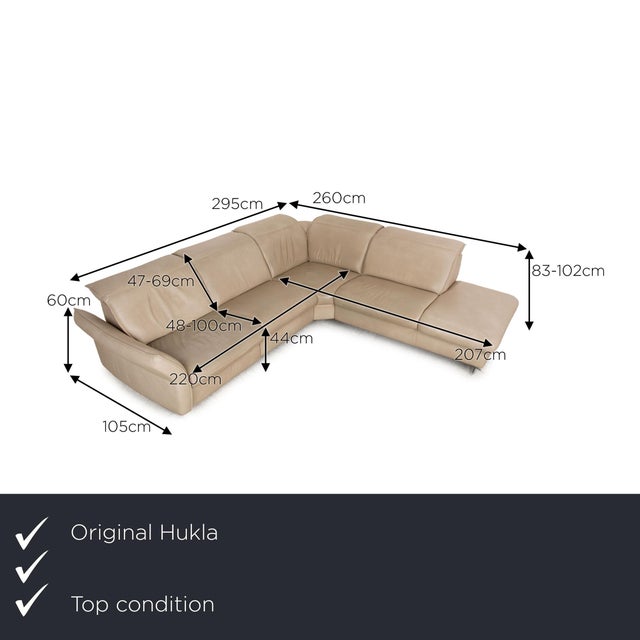 The Davino sofa from Hukla is covered in cream-colored genuine leather and stands on silver metal feet. The electric and...