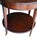 Vintage Mahogany Two-Tier Side Table | Bookmatched Starburst Top | Fluted Legs | Brass Caster Feet For Sale - Image 10 of 11