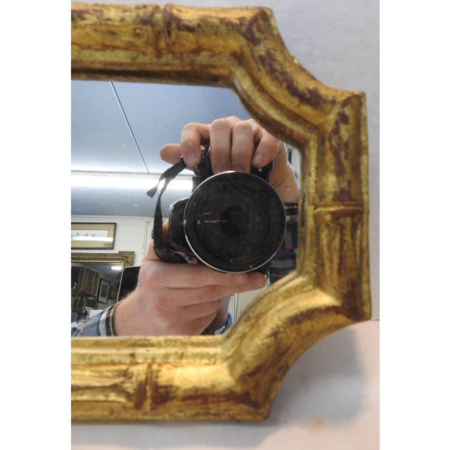 Curves accent the corners of this rectangular mirror by Florentia of Italy in the style of bamboo. The back is covered...