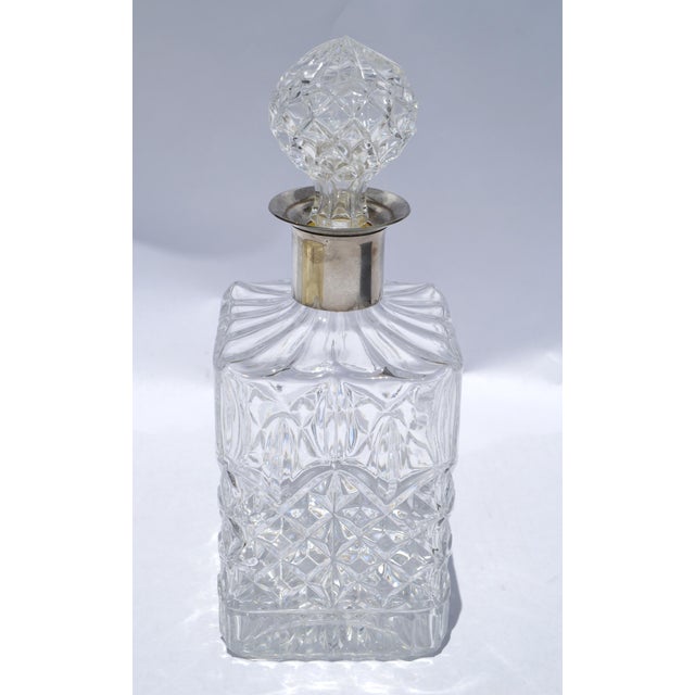 This Boho Chic Heavy Square Cut Crystal Spirits or Whiskey Decanter with a silver-plated neck is a vintage, luxurious...
