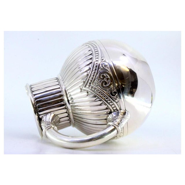 Fluted Silver Wine Jug, in Very Good conditions. Designed 1890 to 1919 This piece has an attribution mark, I am sure that...