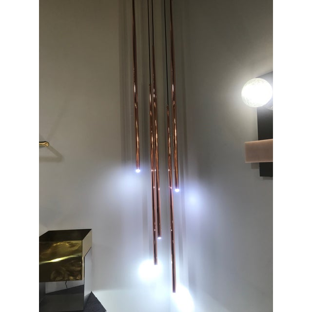 About New copper hanging chandelier pendant lamp Each tube it´s 27.55in height. Additional Options Colors : Copper, Gold,...
