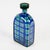 Scozzese, also known as Scottish, also known as Tartan Blown glass ogival bottle, signed "Christian DIOR" on the tip....