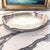 An elegant antique Sheffield silverplate gallery tray dating to the mid 20th century, featuring beautifully engraved...