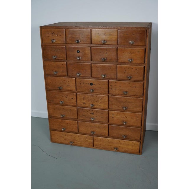 This apothecary cabinet was made circa 1930s in Germany and was later used in a hardware store in Belgium until recently....