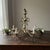Vintage 5-light chandelier with dramatic Hollywood Regency and Spanish Revival styling, likely made in the United States...