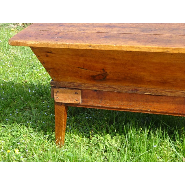 A 19th-century kneading trough on a removable stand with a lid, made entirely of solid oak. The rustic, pegged base...