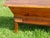 A 19th-century kneading trough on a removable stand with a lid, made entirely of solid oak. The rustic, pegged base...