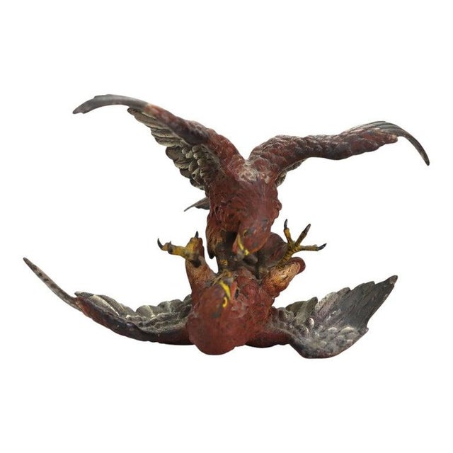 An Austrian cold-painted bronze sculpture of two fighting eagles, attributed to Franz Bergman and dated circa 1890. The...