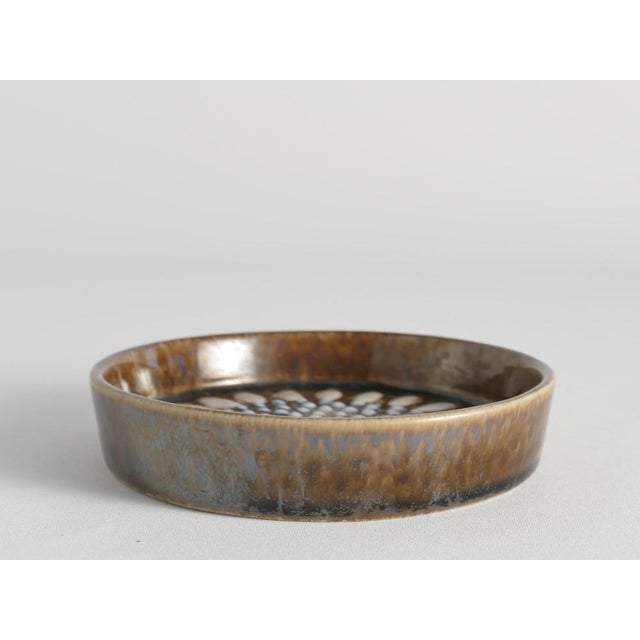 Designed by Sylvia Leuchovius and produced by the renowned Swedish firm Rörstrand, this item showcases her unique style,...